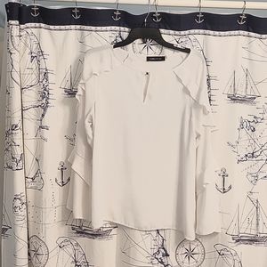White ruffle blouse